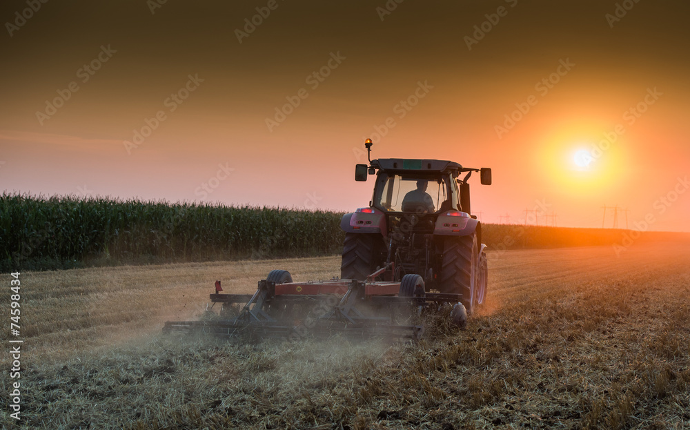 Naklejka premium tractor plowing
