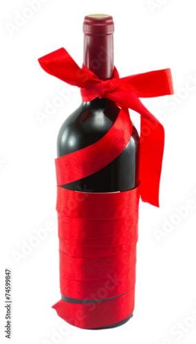 bottle of wine in a red ribbon isolated on white background