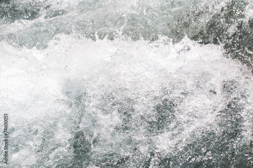 background of stormy water with splashes