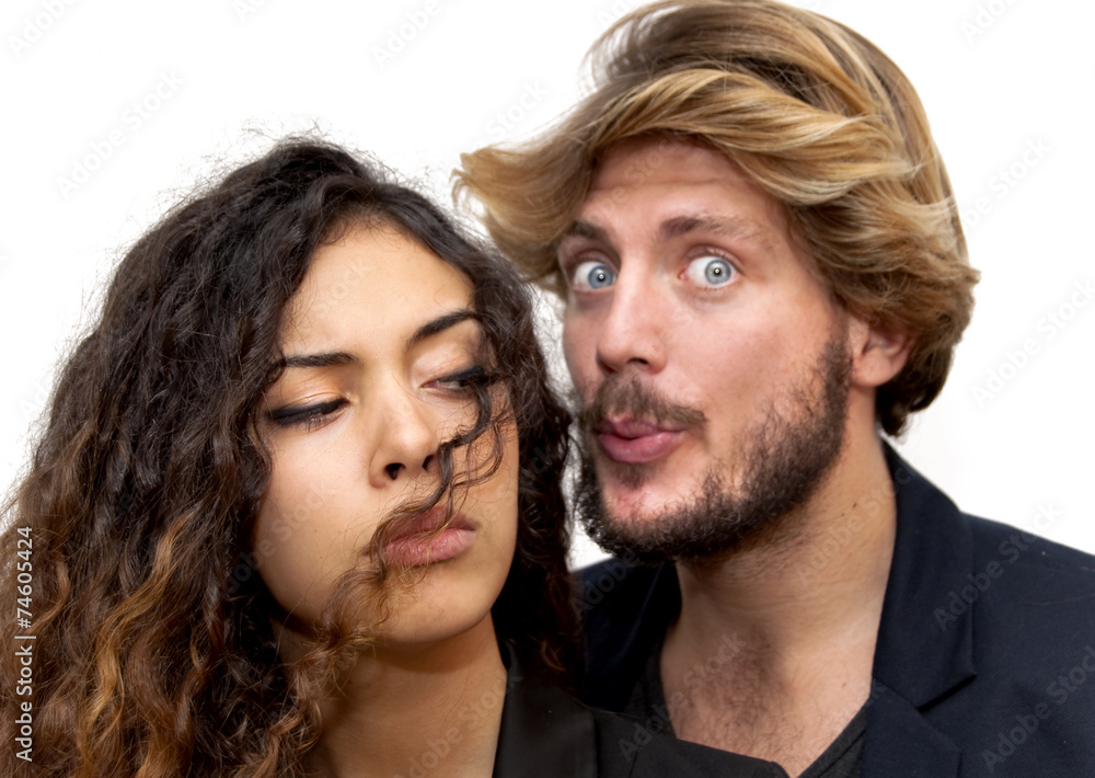 Beautiful portrait of a loving couple where He is blowing her ha