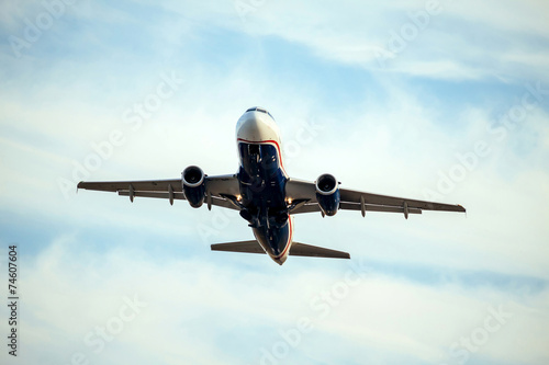 A Commercial air plane taking off.