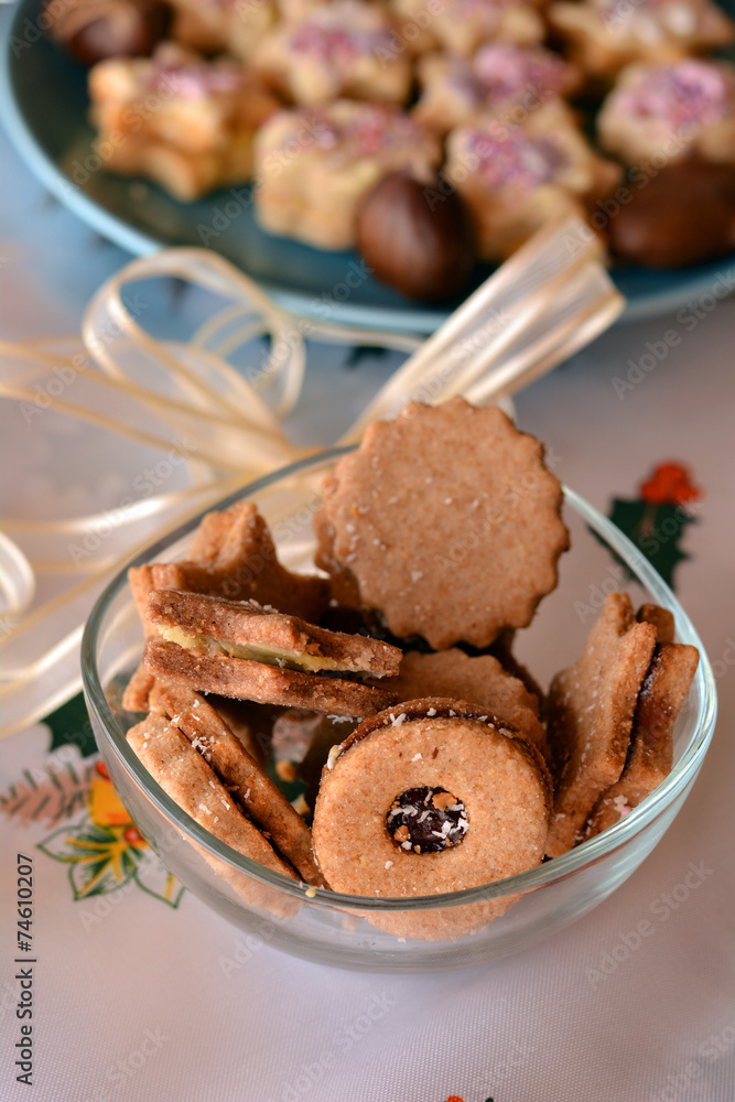 Christmas cookies decorated in the glass bowl on the table Christmas cookies decorated in the glass bowl on the table