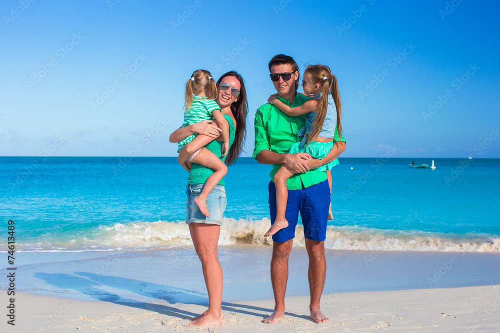 Family of four with two kids during beach vacation Family of four with two kids during beach vacation