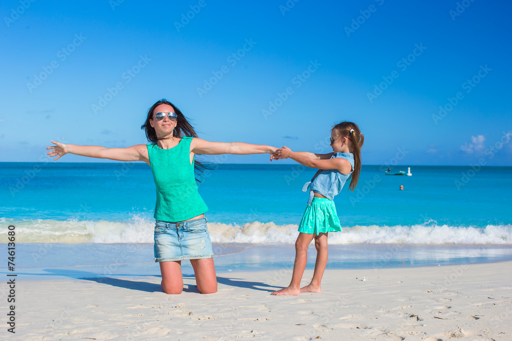 Young mother and adorable little daughter enjoy summer vacation Young mother and adorable little daughter enjoy summer vacation