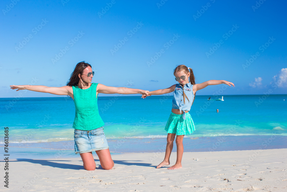 Young mom and little girl during summer vacation Young mom and little girl during summer vacation