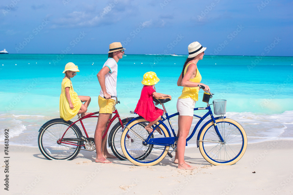 Fototapeta premium Family of four with two kids during beach summer vacation