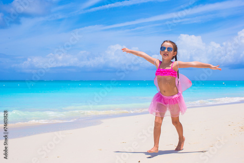 Cute little girl have fun on beach summer vacation