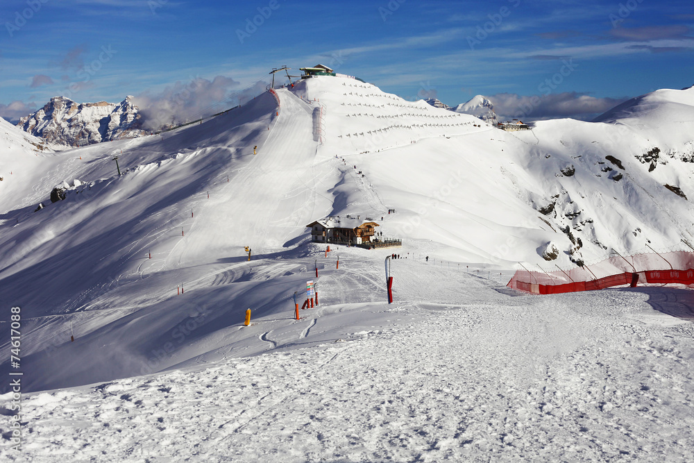 Winter mountain landscape and ski machinery in Trentino