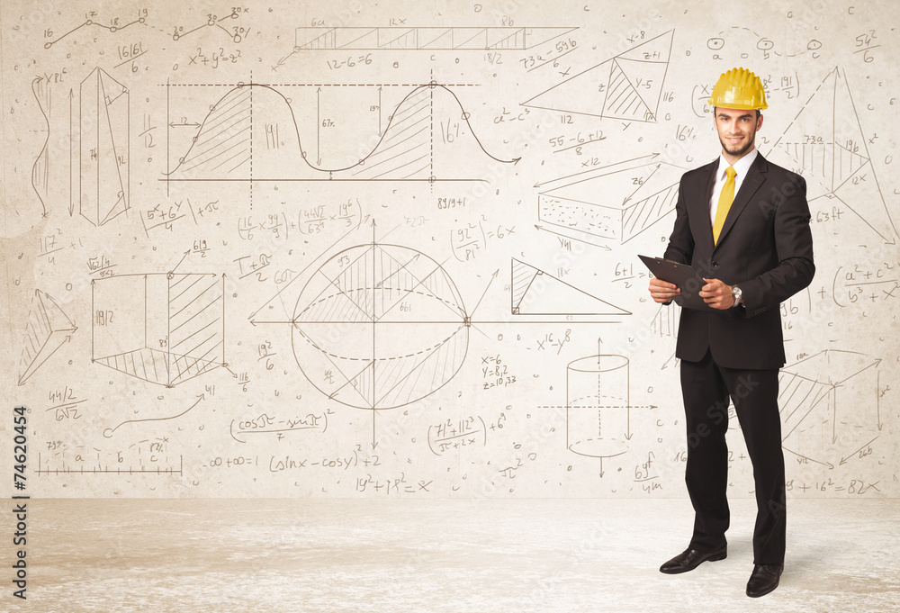 Handsome engineer calculating with hand drawn background