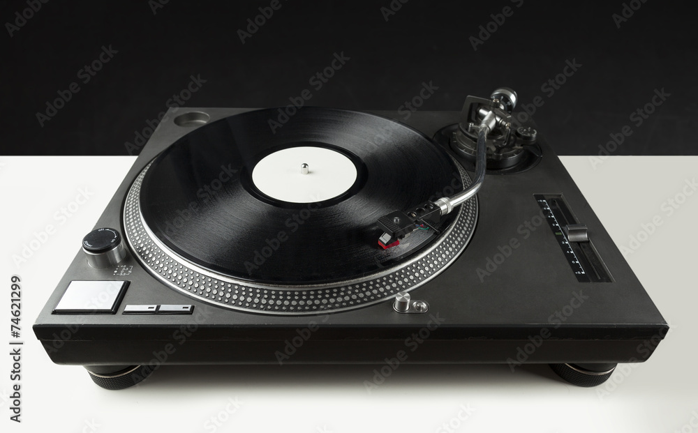 Turntable playing vinyl close up with needle on the record Turntable playing vinyl close up with needle on the record
