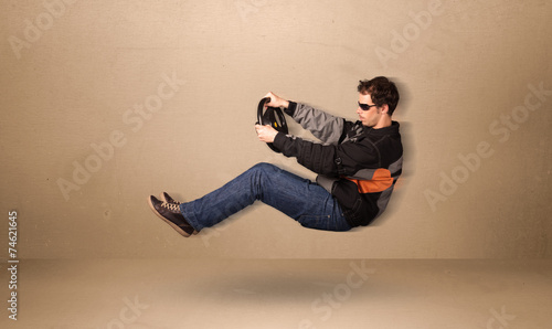 Happy funny man driving a flying car concept