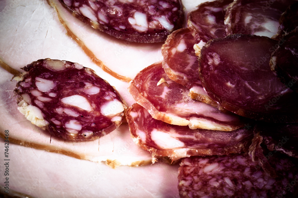 The background - detail of sliced salami. tinted The background - detail of sliced salami. tinted