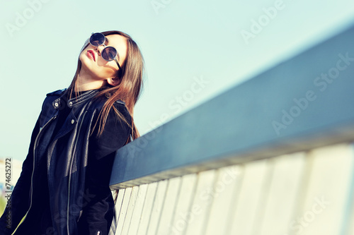 fashion model in sunglasses posing outdoor