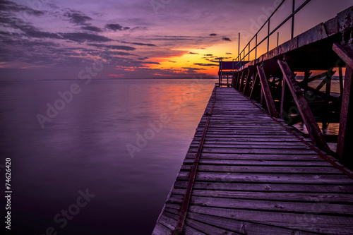 Fototapeta Naklejka Na Ścianę i Meble -  Pier in sea at sunset