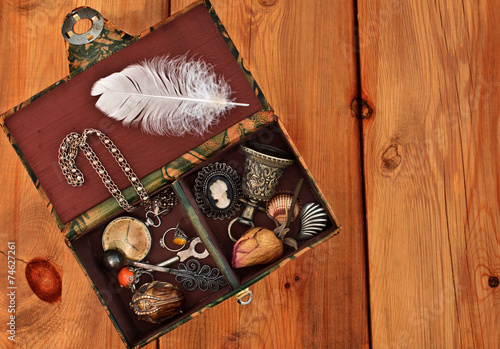 Vintage box with trinkets and women's jewelry
