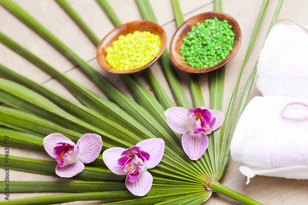 Spa and wellness setting with flowers, candles and towel Spa and wellness setting with flowers, candles and towel