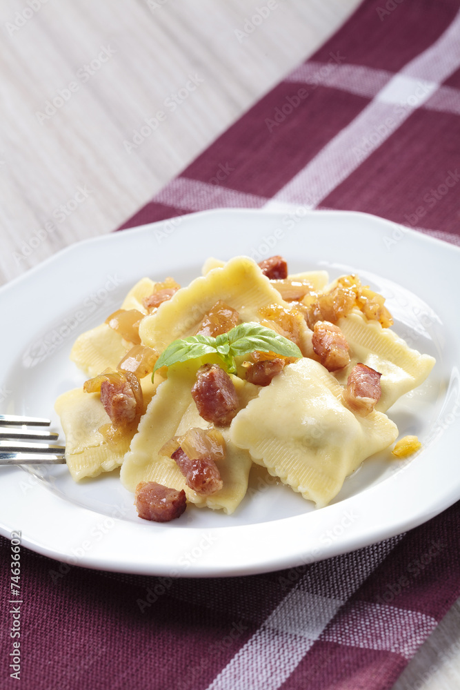 Portion of ravioli with onion and bacon Portion of ravioli with onion and bacon