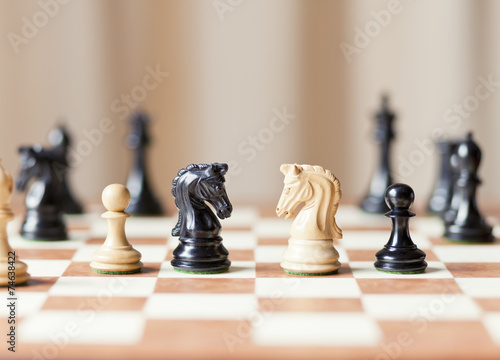 Canvas Print Chess pieces set on a chessboard