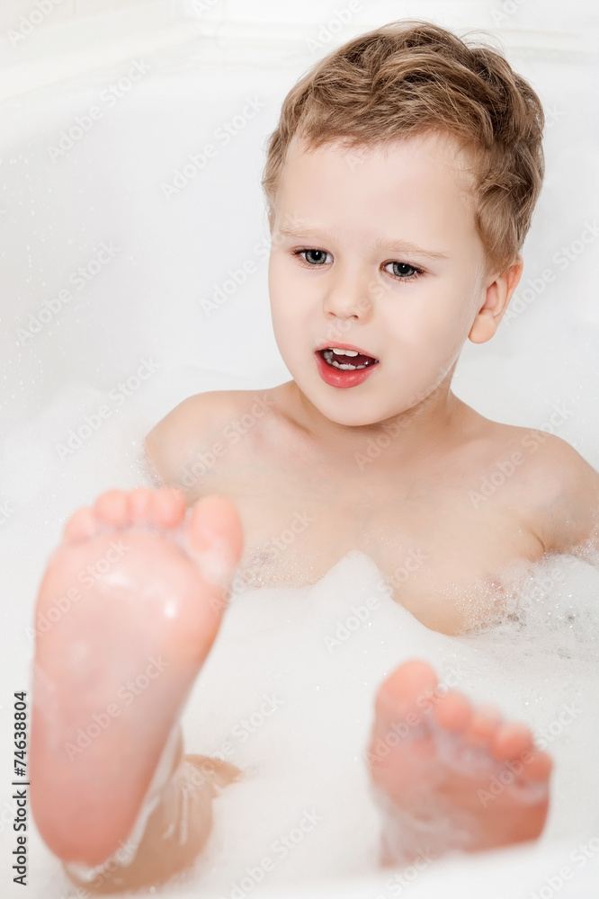 Cute kid taking bath with foam Cute kid taking bath with foam