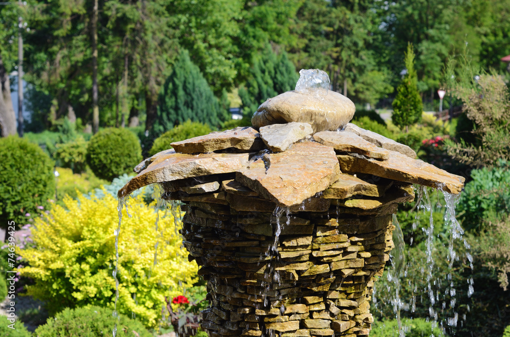 The original decorative fountain in a botanical garden The original decorative fountain in a botanical garden