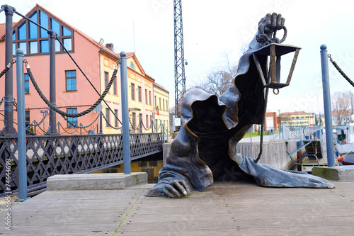 statue of the creeping ghost on the embankment of Klaipeda, Lith photo