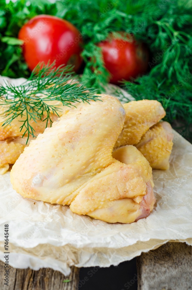 Raw chicken wings on wooden background Raw chicken wings on wooden background