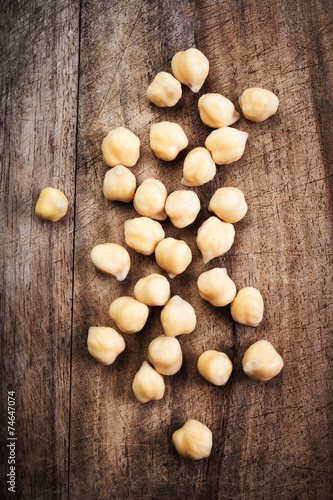 Fresh Prepared Chickpeas over rustic wooden table close up.