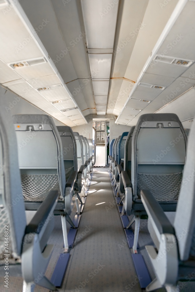 Fototapeta premium Interior of an airplane with many seats