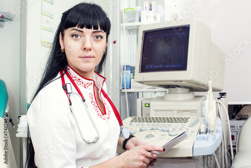 Doctor woman in the office of ultrasound photo