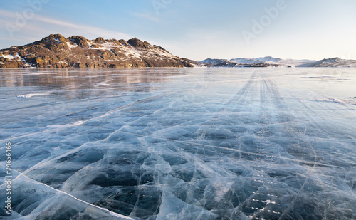 Lake Baikal winter morning. Ice road on Olkhon island