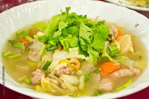 A bowl of hot Broth or Vegetable Soup
