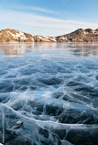 Baikal Lake. Sunny morning. Pattern on smooth ice