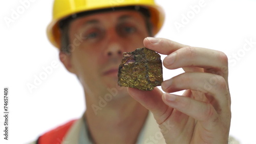 Miner Inspects Copper Sulfide Ore photo