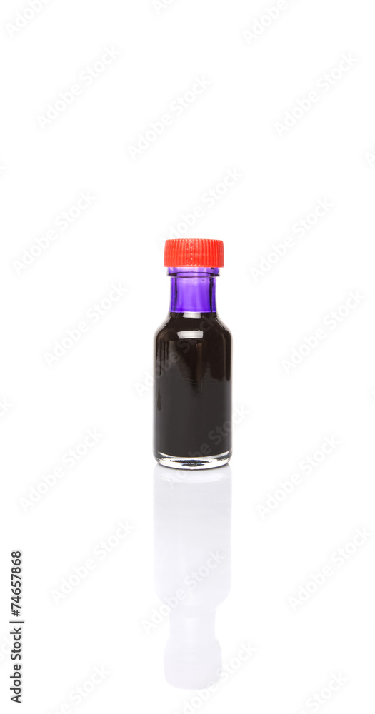 Liquid purple food color additive over white background
