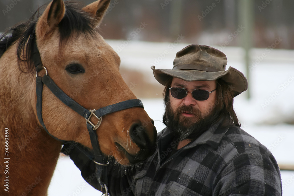 Fototapeta premium Bearded Man Standing With his Horse