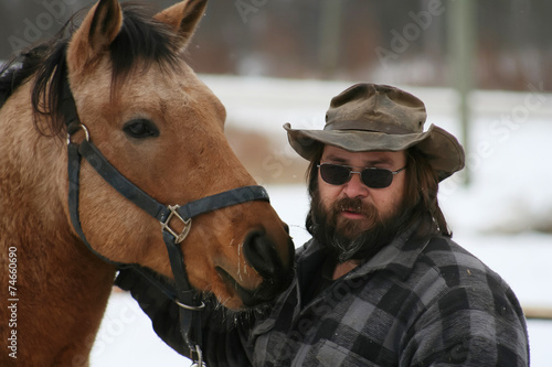 Bearded Man Standing With his Horse