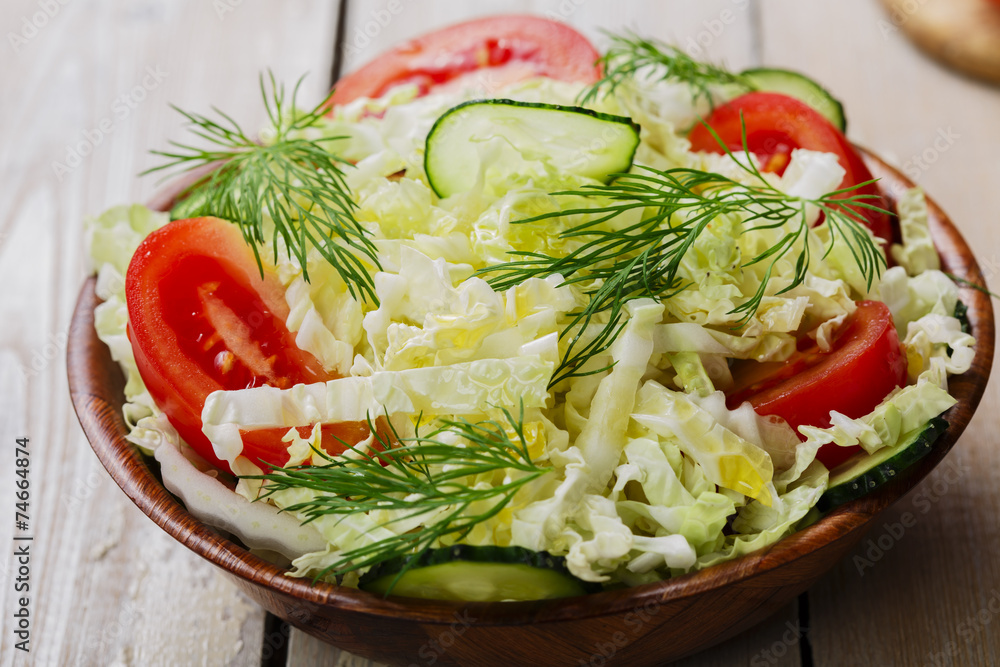 Cabbage salad with cucumbers and tomatoes