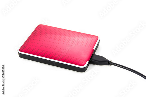 Red external hard drive on white background