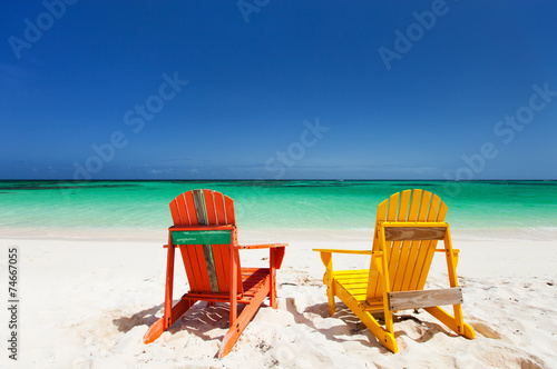 Fotografija Colorful lounge chairs at Caribbean beach