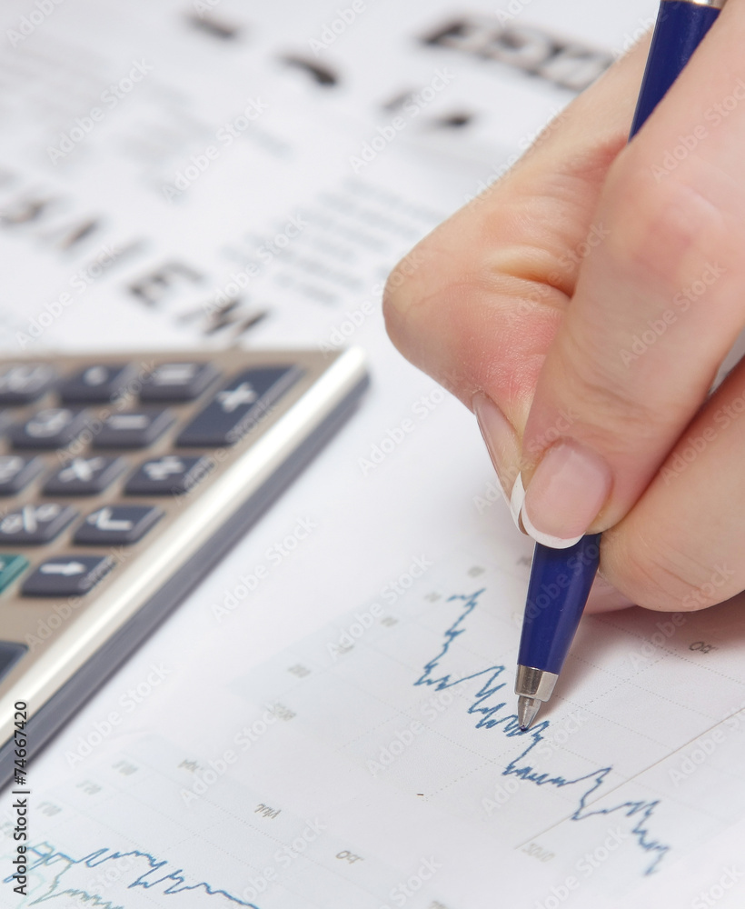 A close-up image of a hand with a pen showing a diagram A close-up image of a hand with a pen showing a diagram