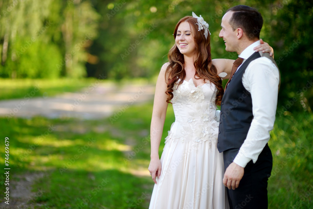 Young bride and groom hugging