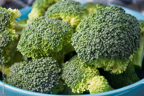 Fresh broccoli in blue bowl