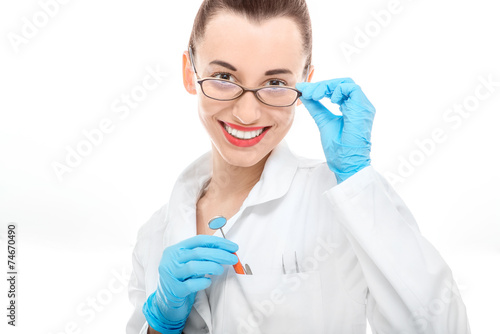 Portrait of young woman doctor on white background