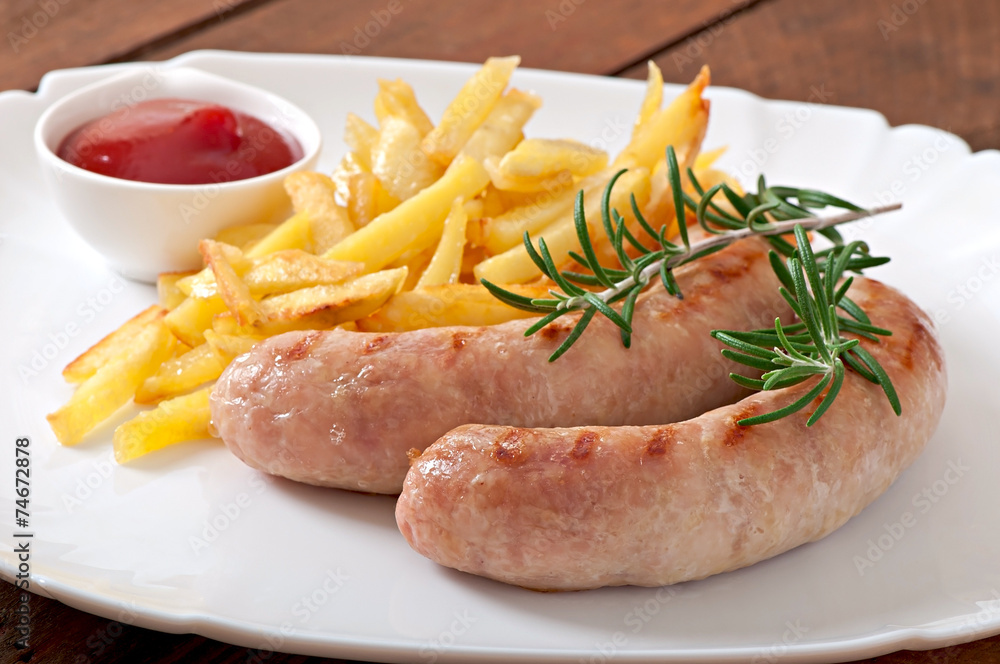 Chicken sausages grilled with a side dish of french fries Chicken sausages grilled with a side dish of french fries