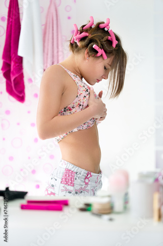 Принти на полотні female adolescent looking her stomach