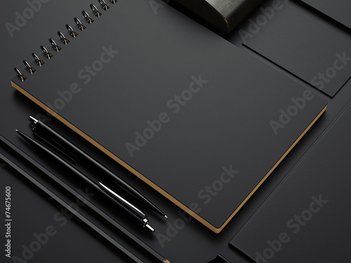 black branding elements on black paper photo
