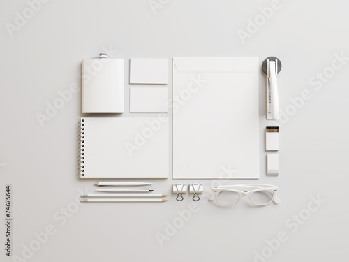 Set of white branding elements on paper background photo