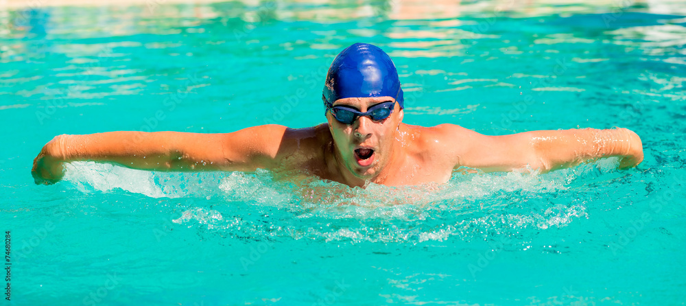 portrait of a young swimmer going in for sports