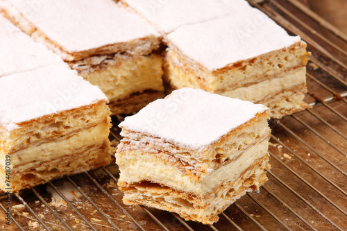 Cakes with cream on puff pastry