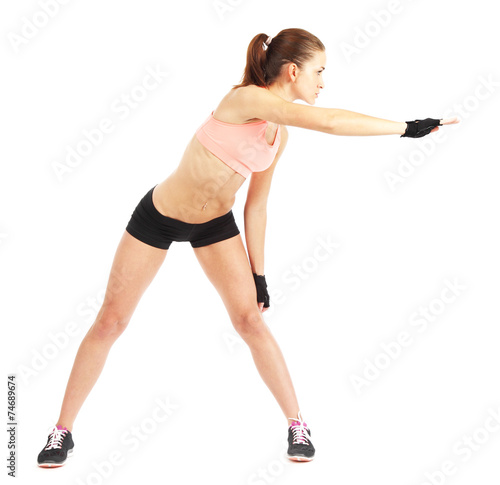 Fit woman stretching to warm up - isolated over white background